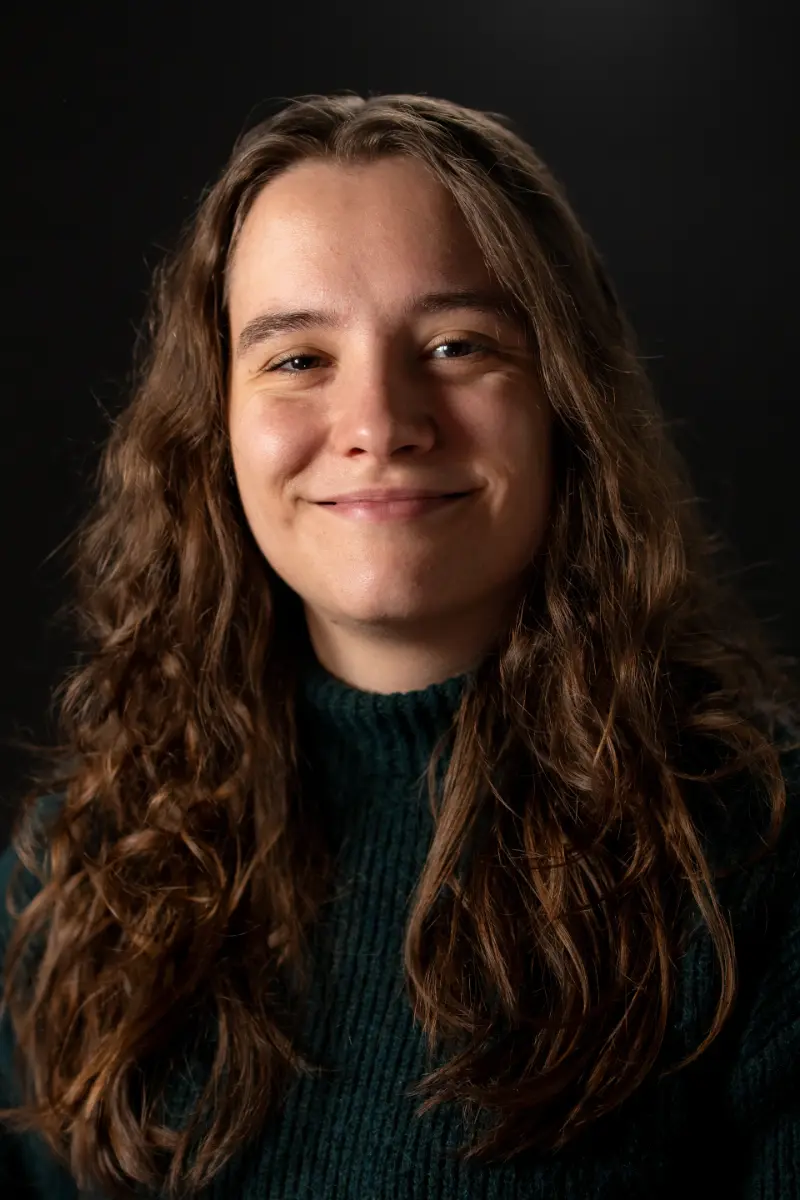 Julia2 Professional portrait of Marcel, CEO and Co-Founder of BlueBottle, smiling in a green turtleneck sweater